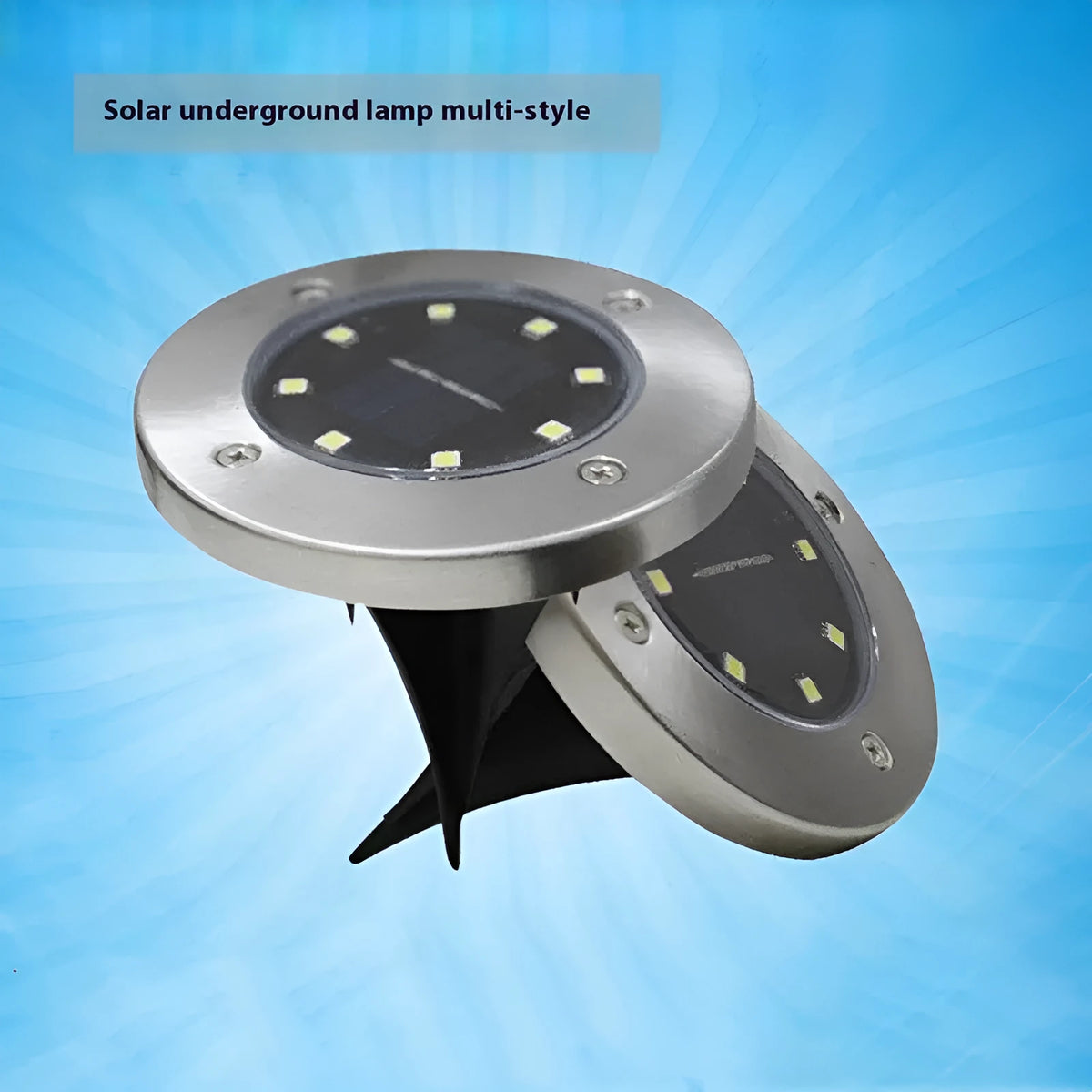 Stainless steel solar garden ground lamp installed in a lawn.
