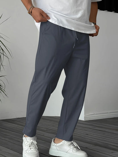 Men's khaki drawstring trousers with ribbon-trim pockets and straight-leg fit