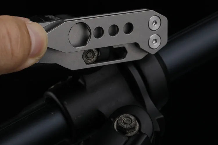Titanium alloy multi-function crowbar tool with bottle opener on a stone wash finish background.