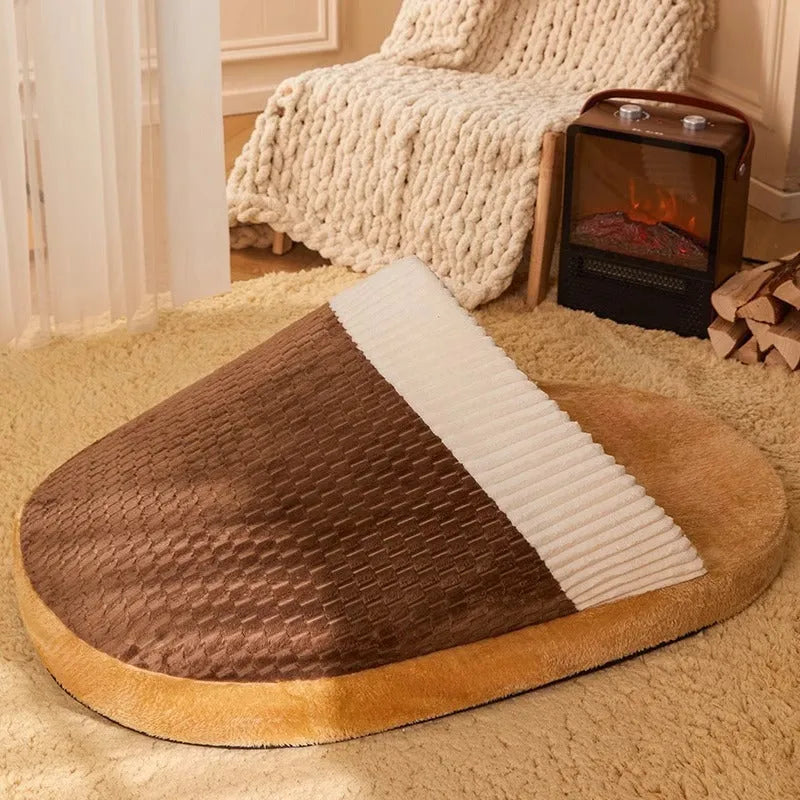 Blue foldable dog nest sleeping bag with removable fleece lining, shown unfolded on a floor.