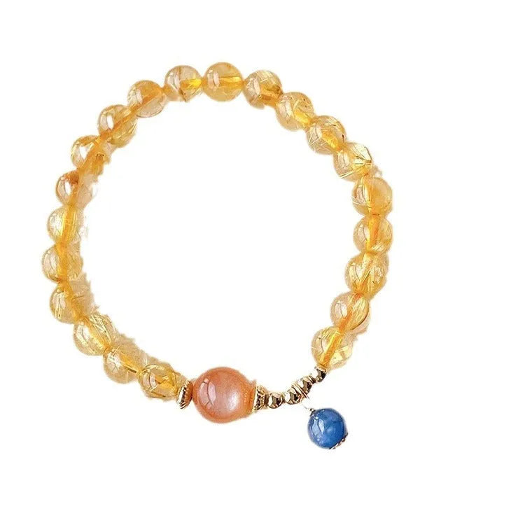 Gold rutilated quartz sunstone crystal bracelet with diamond shape and round elements for women