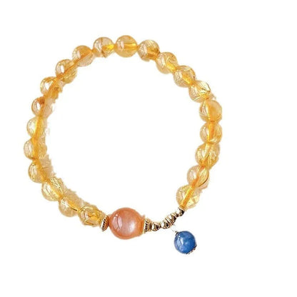 Gold rutilated quartz sunstone crystal bracelet with diamond shape and round elements for women