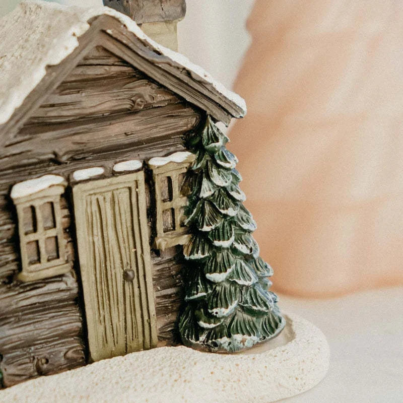 Rustic log cabin incense burner with intricate details, filling the air with soothing aromas