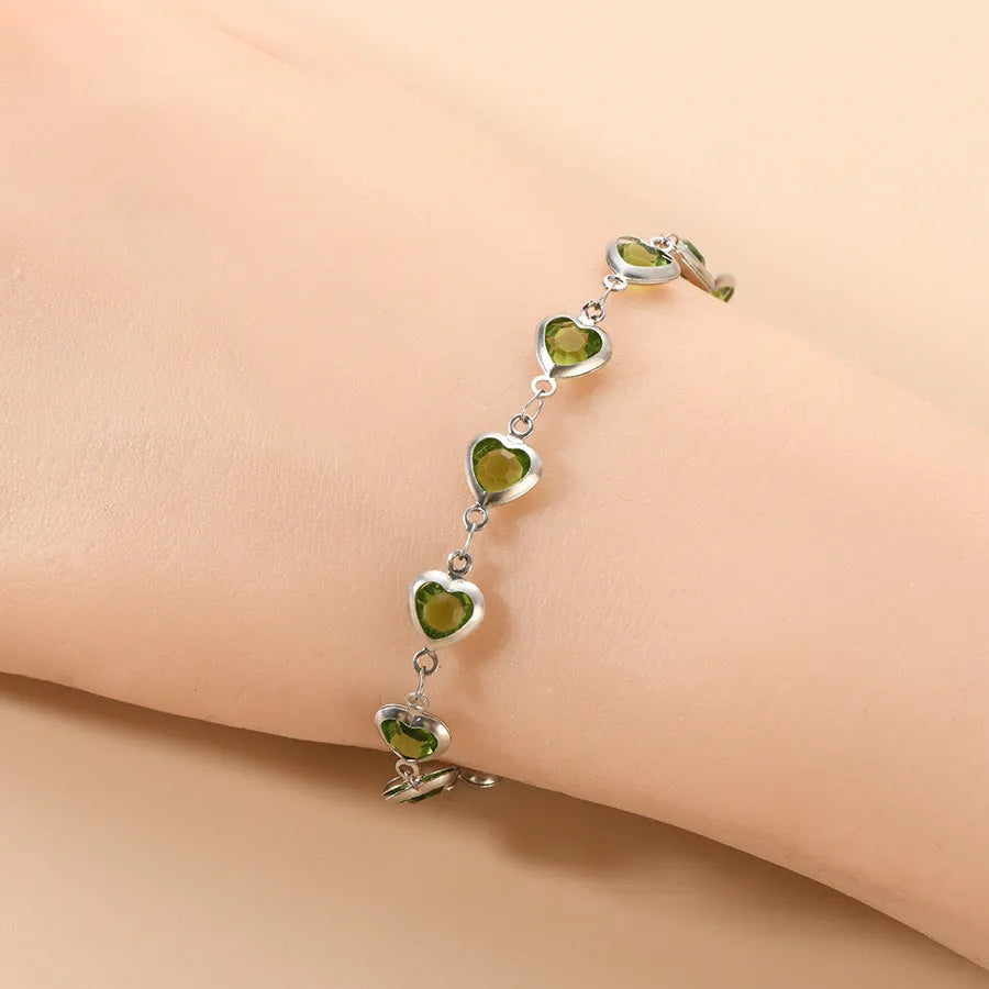 Devil's eye geometric heart bracelet in stainless steel showing colourful electroplated finish options.