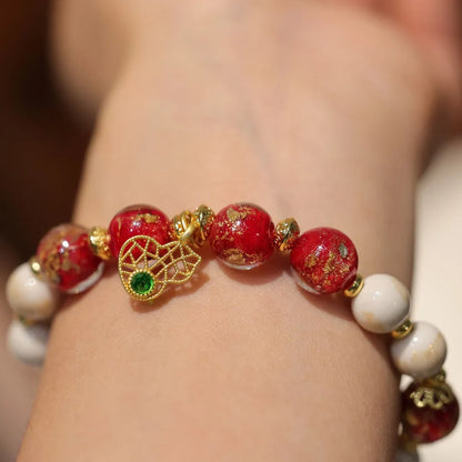 Women's geometric ethnic style bracelet with gold foil decoration on coloured glaze in two colour variations