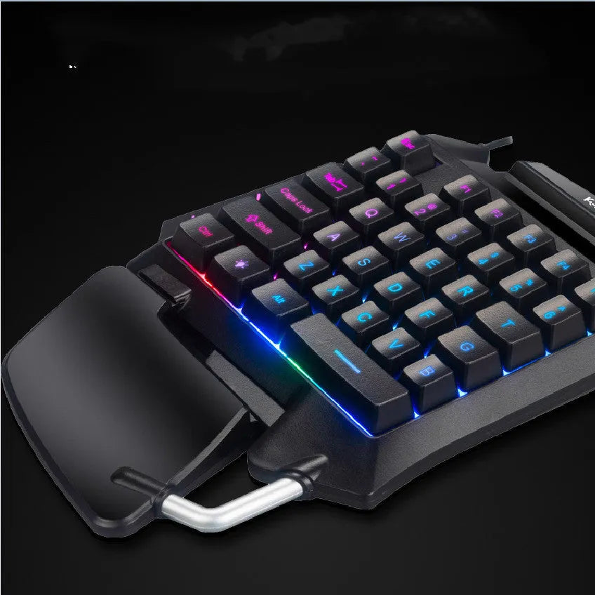 Black one-handed gaming keyboard with left-hand controls and integrated throne converter for desktop PC