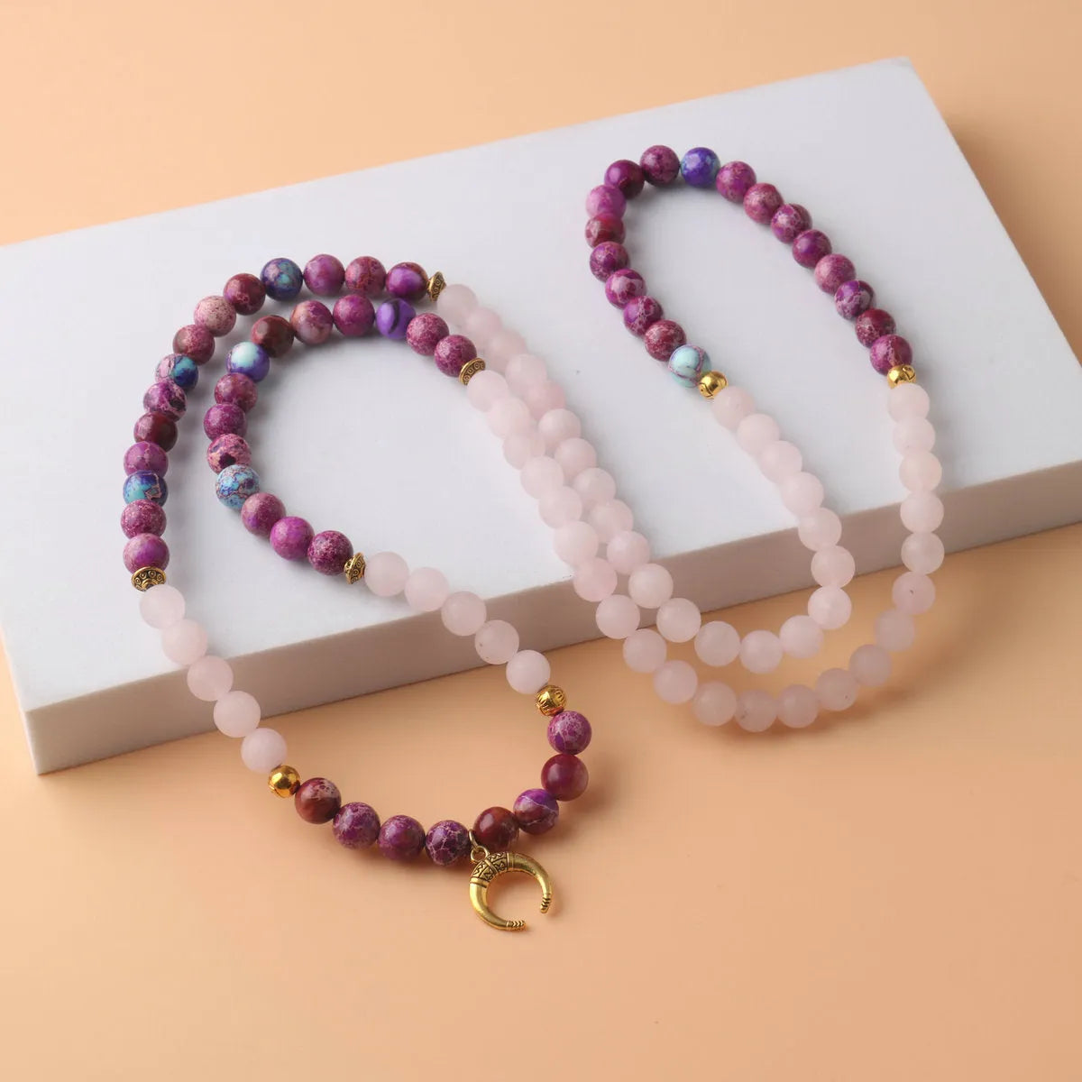 Personalised pendant necklace with round pink Emperor Stone crystal beads on a silver chain.