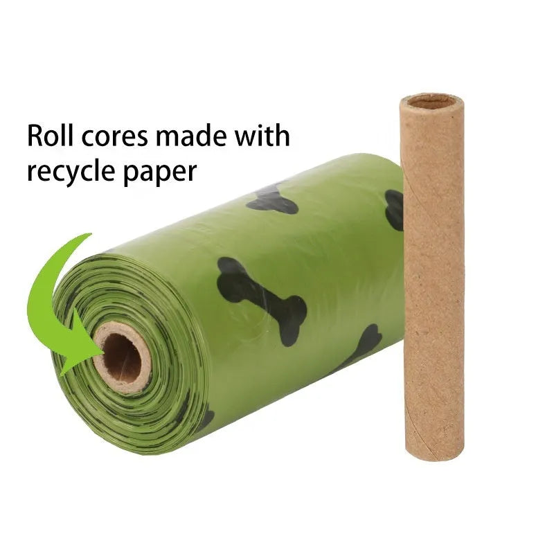 Roll of military green degradable dog poop bags with black bone print, shown next to a plastic dispenser.