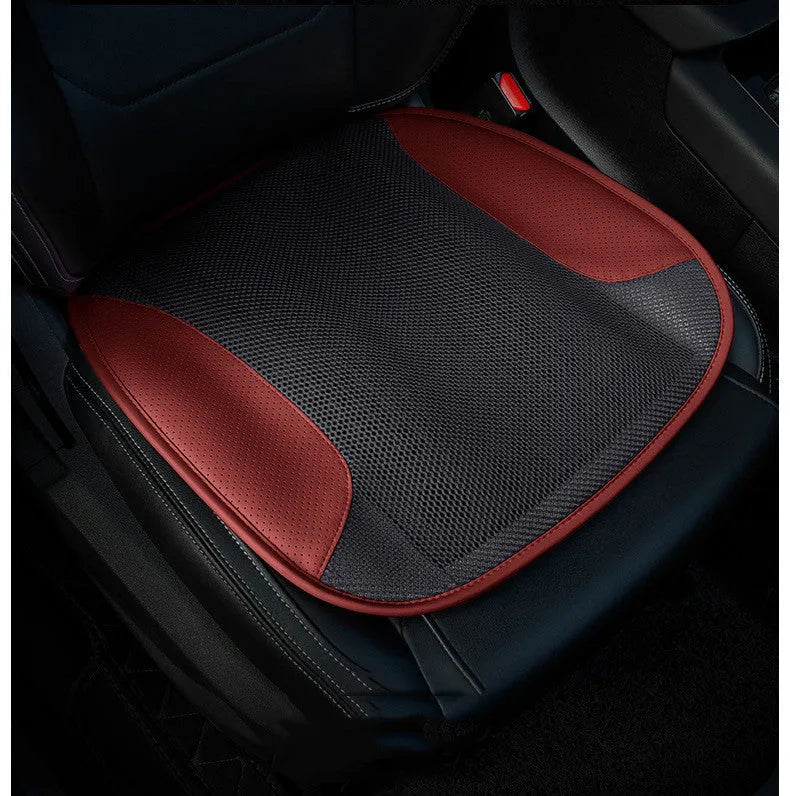 USB ventilated car seat cushion in black suede with visible fan vents, placed on a car seat.