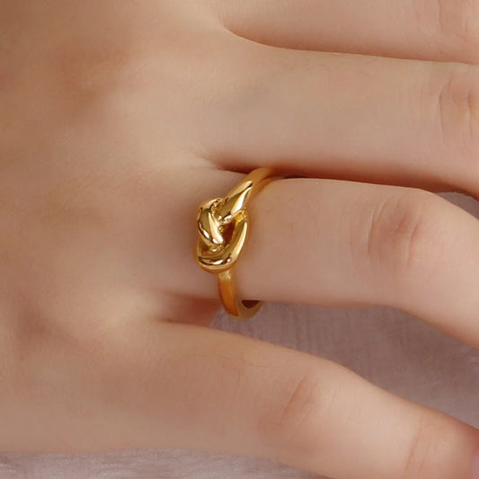Elegant Truelove Knot Titanium Steel Ring in gold and rose gold finishes