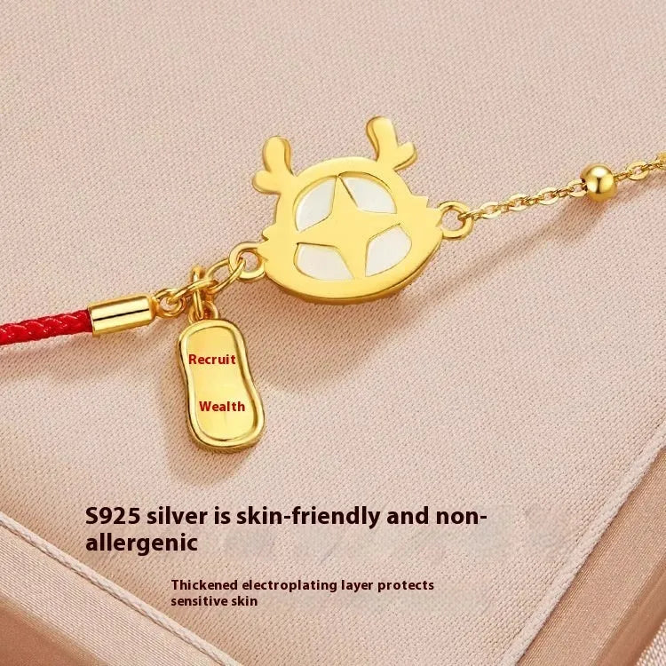 Silver-plated dragon zodiac bracelet for women with Hetian jade accents on a white background.