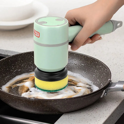 Green electric cleaning brush with multiple brush heads on a kitchen worktop.