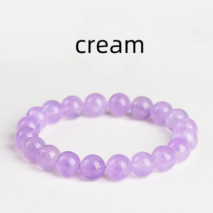Lavender amethyst bracelet with water ripple design on beads, showing cream body and transparent colour options