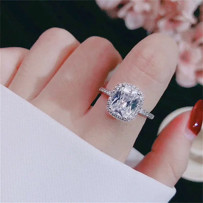 Women's silver colour alloy ring with artificial gemstone inlay and geometric design, bridal style.