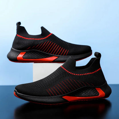 Men's black and white striped slip-on sneakers with lace-up front and mesh upper.
