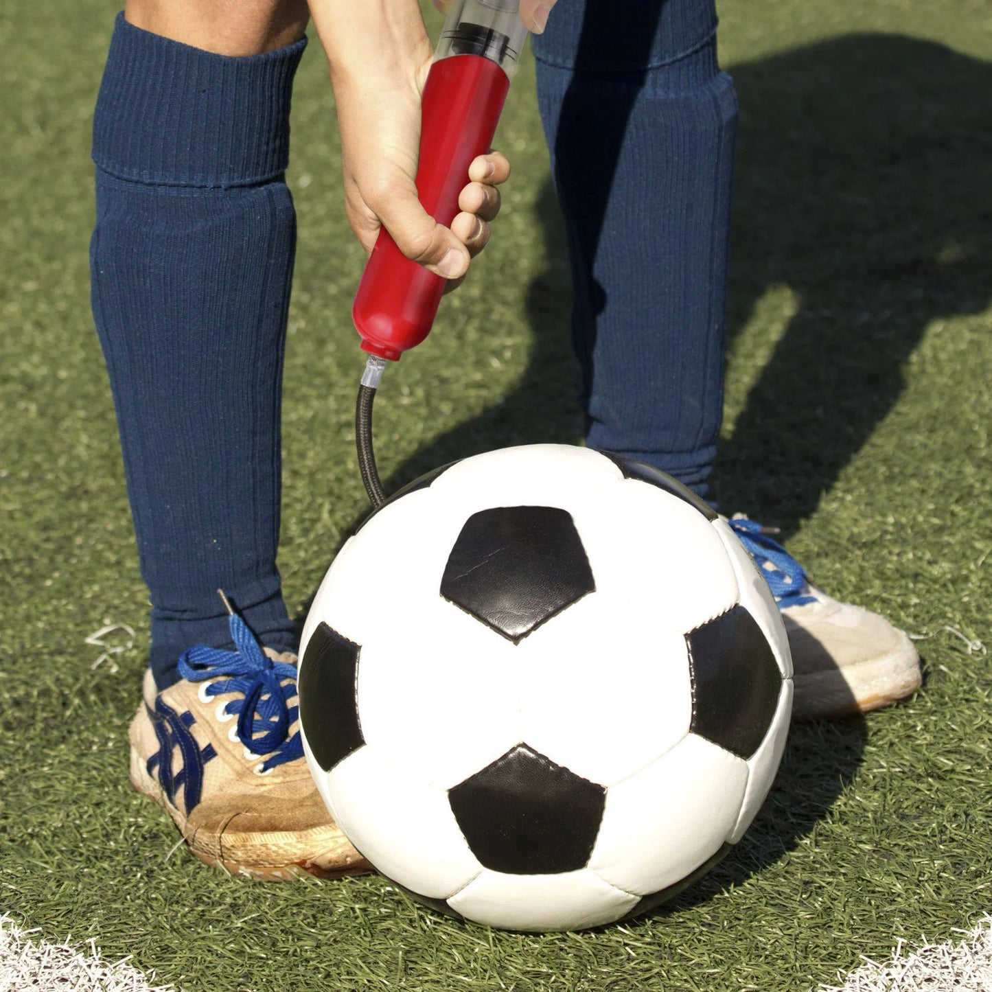 Portable air pump for basketball, football, and volleyball with double-action mechanism