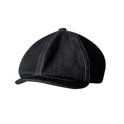 Black Japanese denim cotton beret hat showing octagonal cap style on neutral background