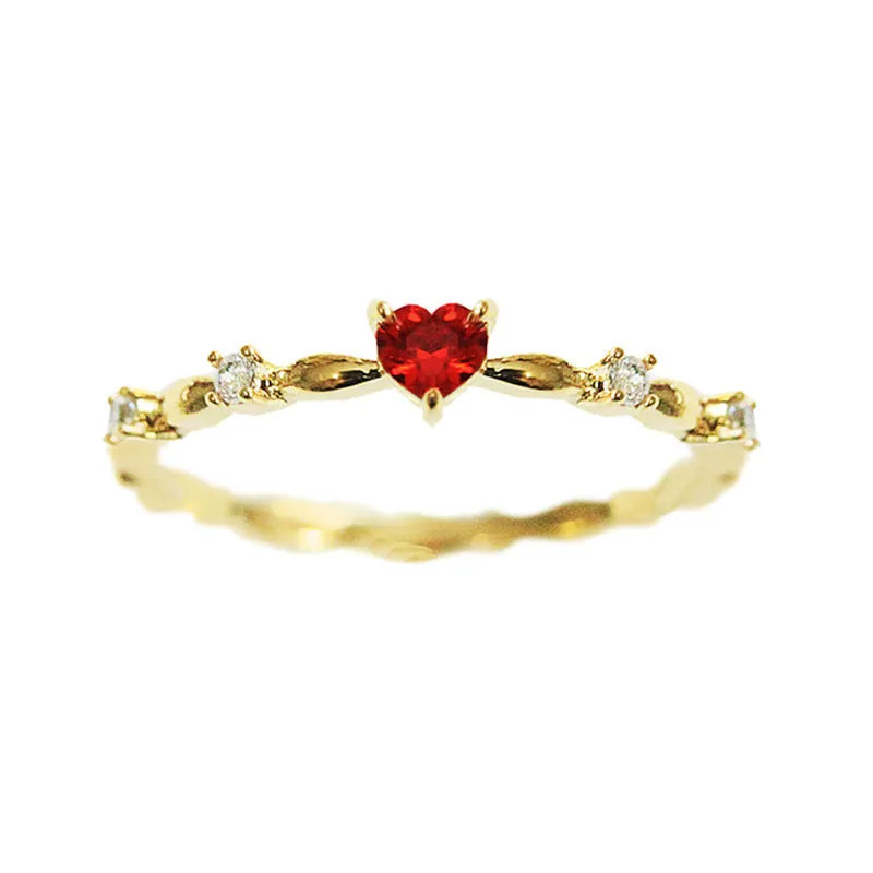 Gold and silver tone peach heart ring with zircon decoration, shown in sizes 6-10