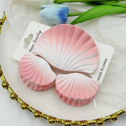 Gradient frosted plastic hair clip set in three pieces with shell decoration
