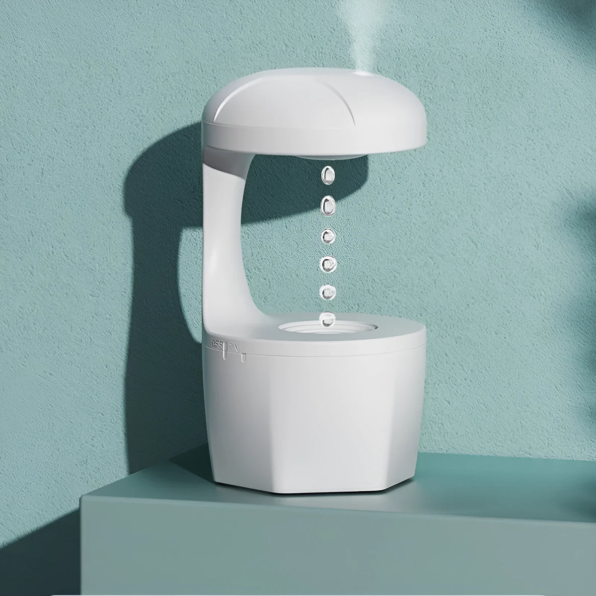 White, pink, and green column-shaped USB-powered ultrasonic humidifier.