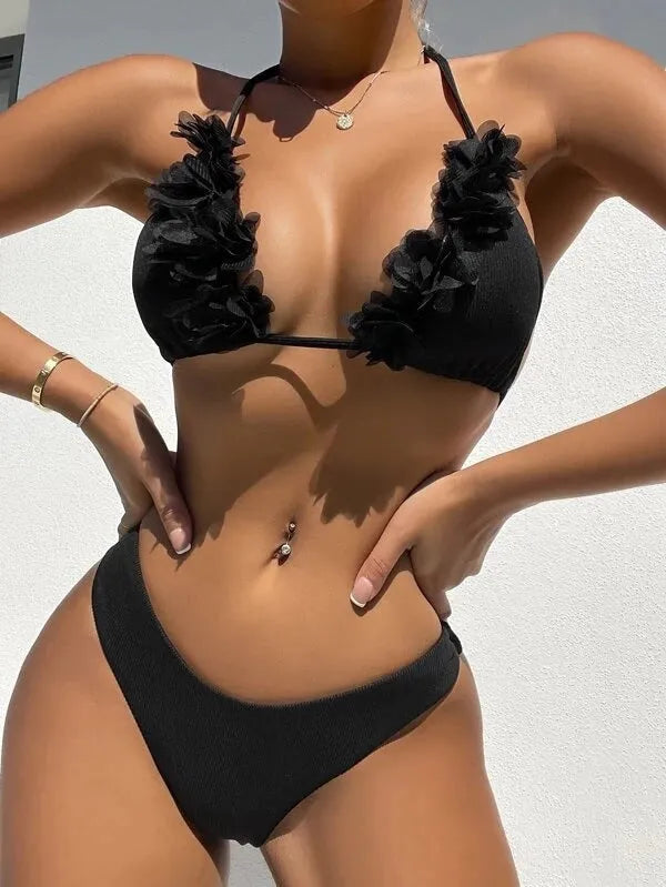 Black two-piece swimwear set with gathered top design and matching shorts