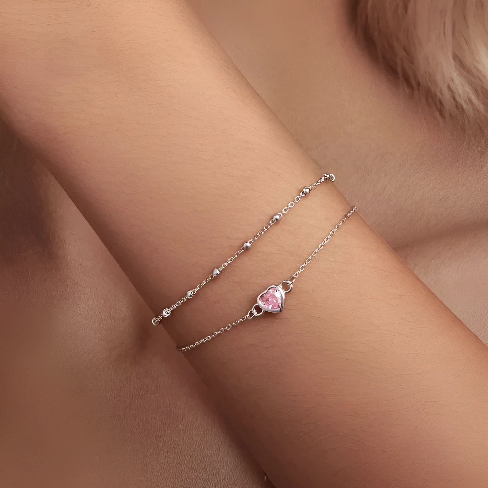 Sweet girlish sterling silver bracelet with a small heart charm on an adjustable chain.