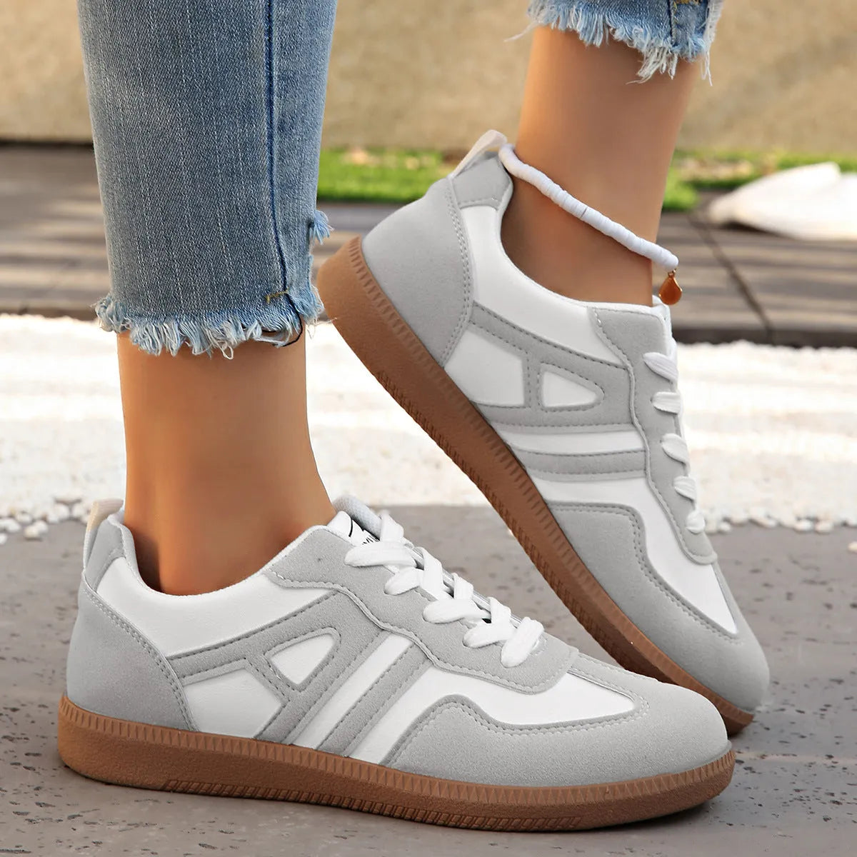 Women's retro lace-up jogging shoes in black, grey, and khaki with low platform heel.