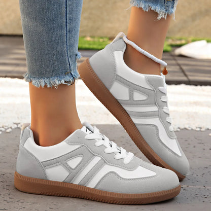 Women's retro lace-up jogging shoes in black, grey, and khaki with low platform heel.