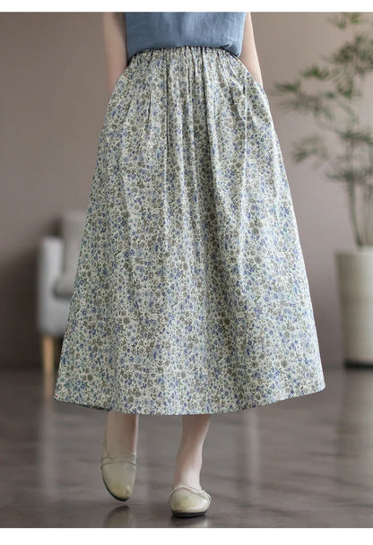 Elegant floral-printed cotton skirt with pleated design, available in yellow and blue flower patterns