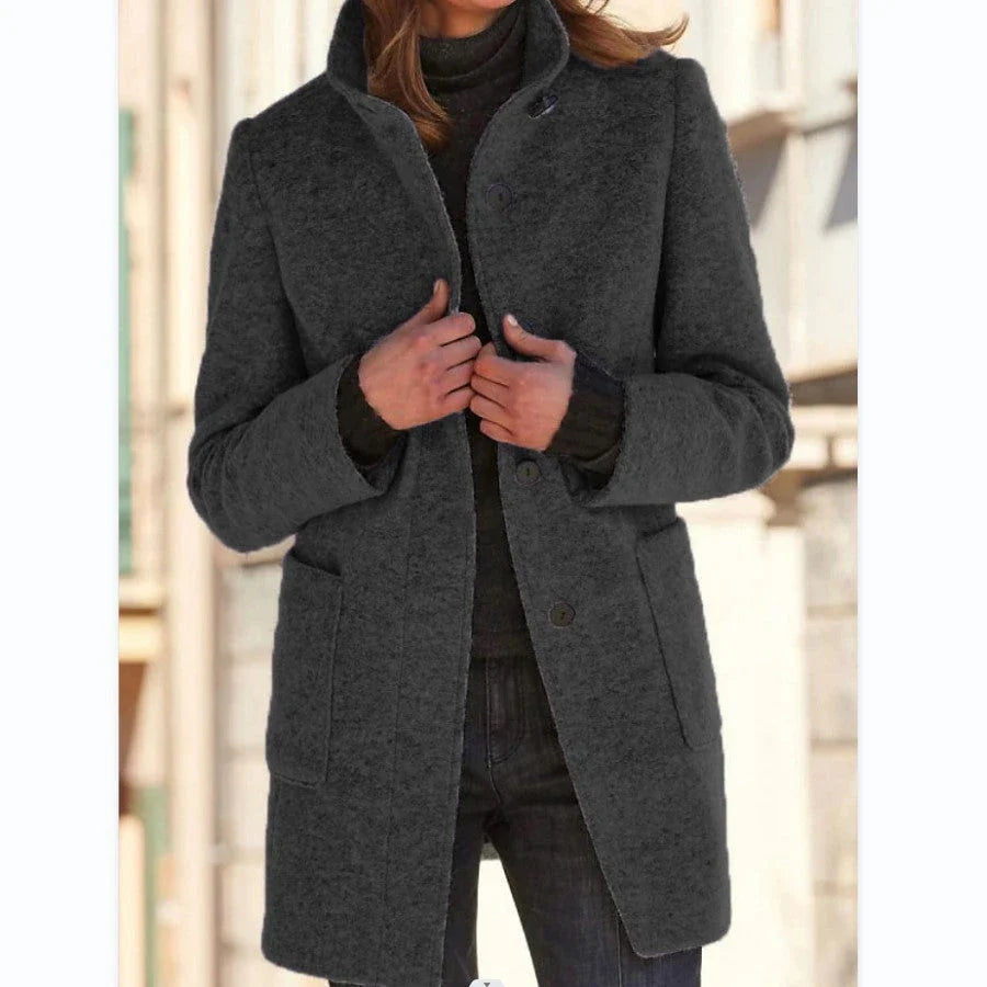 Stylish wool coat with stand collar, pockets, and slim fit design for casual winter wear.