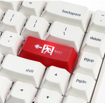 Transparent keyboard key cap with safety evacuation exit symbol design