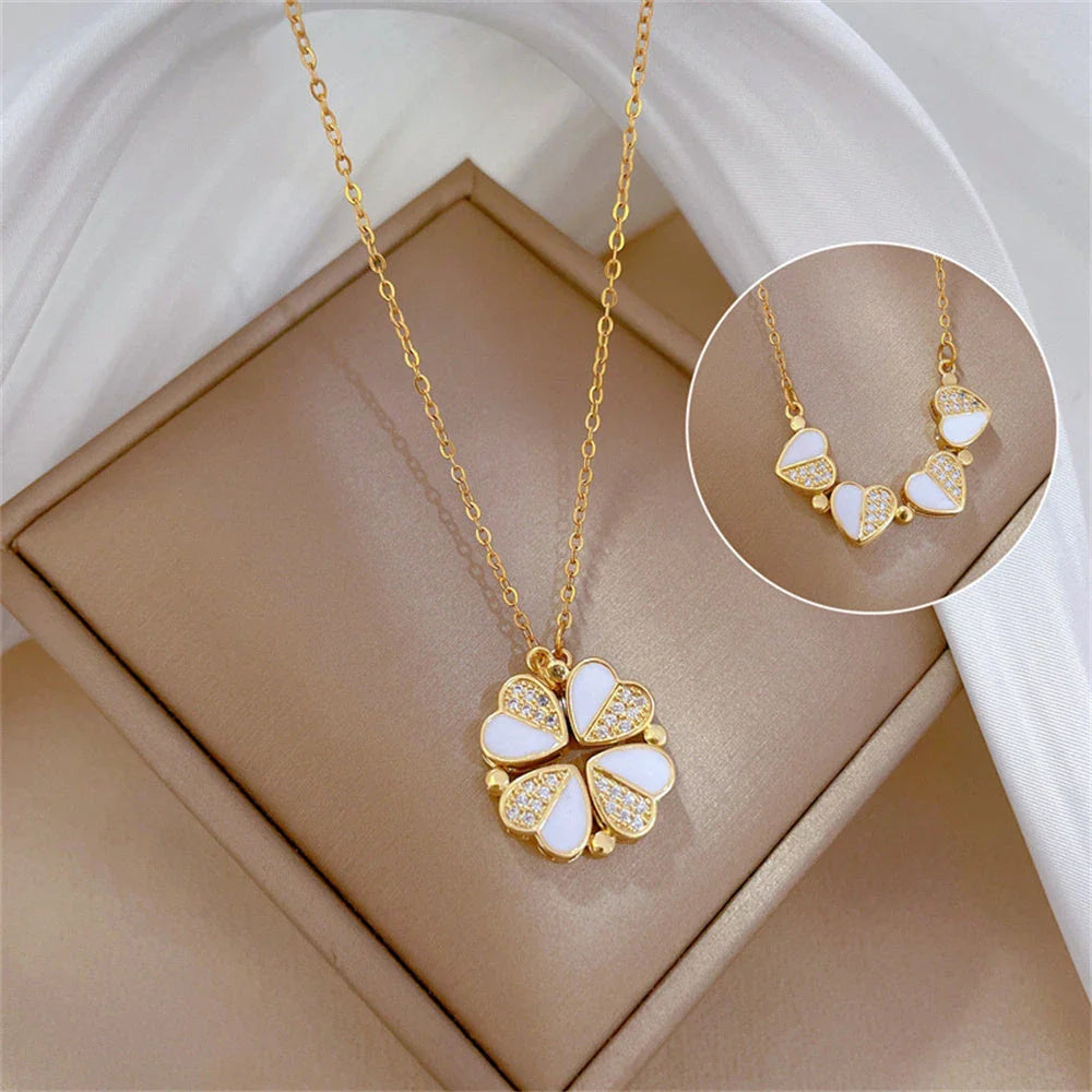 Exclusive four-leaf clover pendant necklace in stainless steel with crystal heart charm, a versatile jewellery piece for women