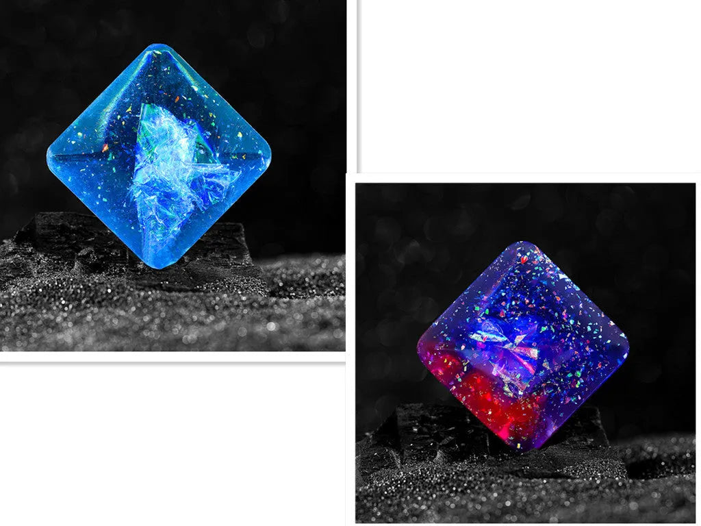 Galactic edition pocket gyro desk toy on a surface, showing its quadrilateral resin construction and celestial colour design.