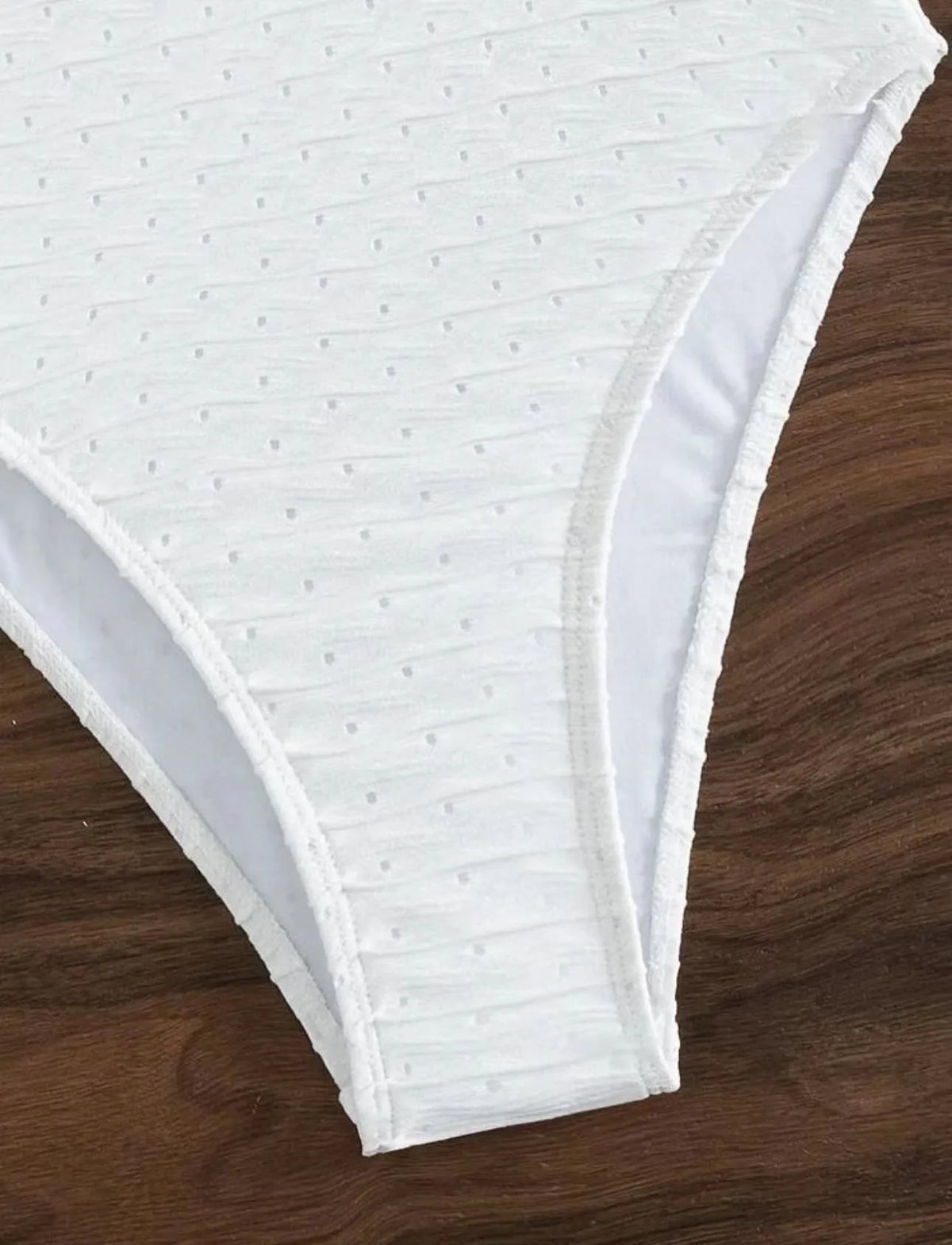White one-piece swimsuit for women with sling design made from quick-drying polyester fabric