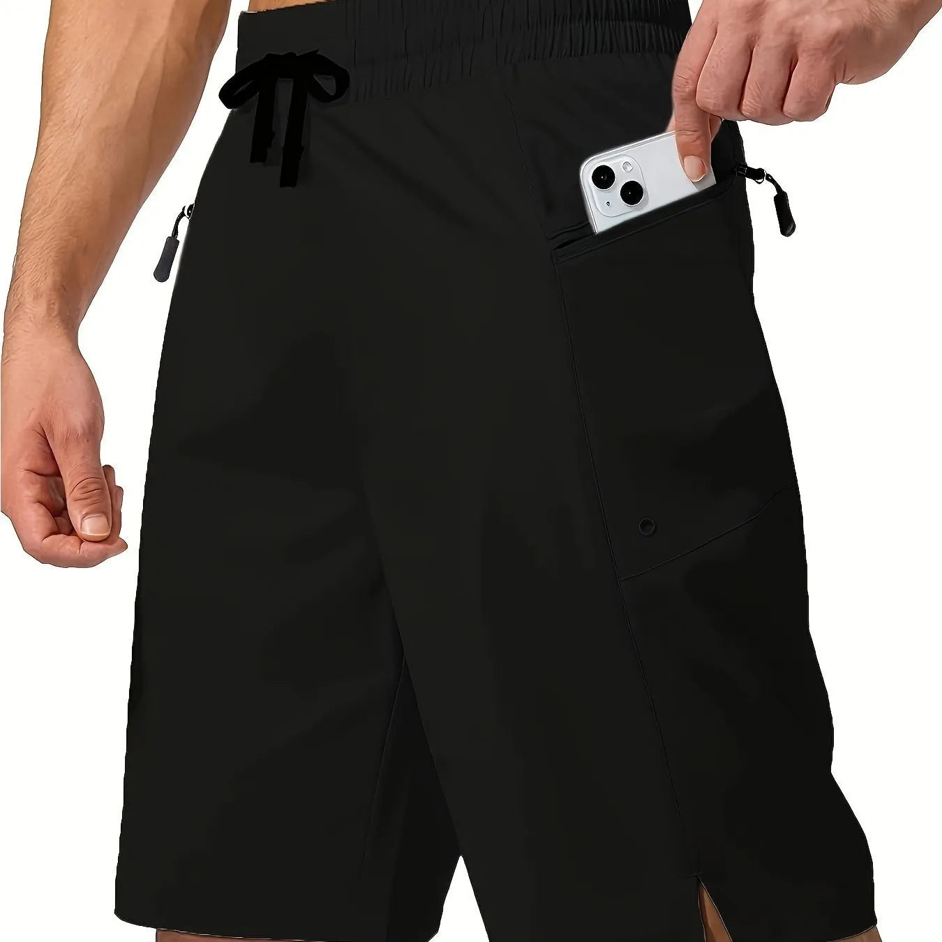 Man wearing solid colour straight-leg beach shorts in quick-dry polyester fabric.
