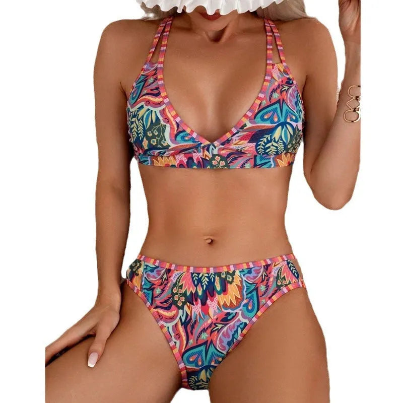 Women's printed halter neck swimsuit top and swim pants in a mixed colour pattern.