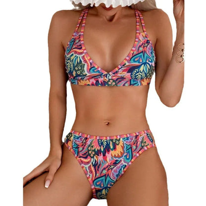 Women's printed halter neck swimsuit top and swim pants in a mixed colour pattern.