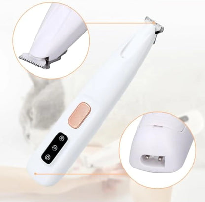 White rechargeable electric dog paw trimmer with LED light on a grey surface.