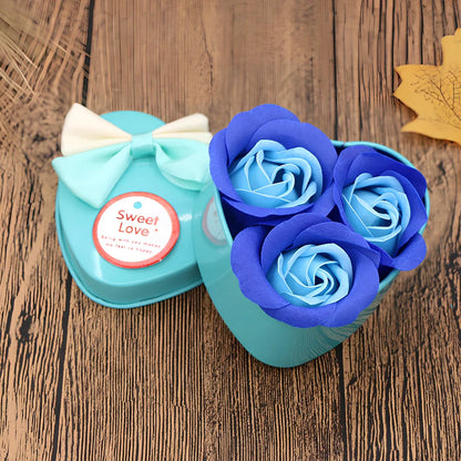 Handmade soap flowers in red heart-shaped tin box measuring 12x12x5cm