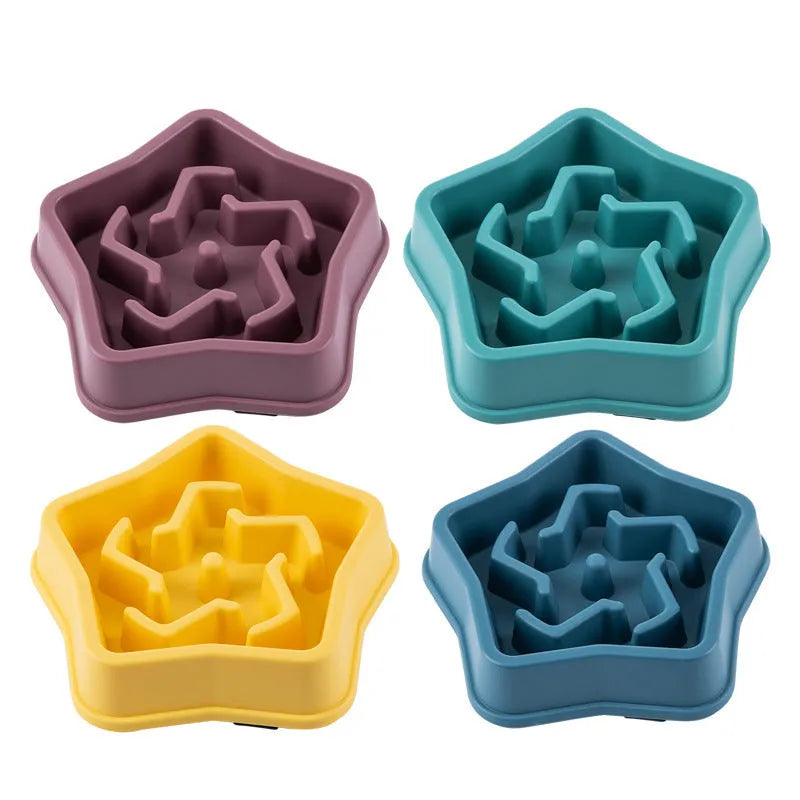 Yellow plastic slow feeding dog bowl with raised obstacles at base to prevent choking