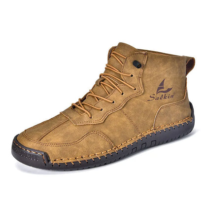 A pair of beige high-top casual boots with elastic band fastening and a flat rubber sole.