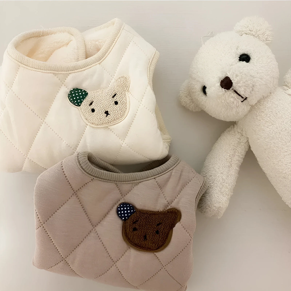 Quilted pet vest for small dogs with bear patch and polka-dot ears, padded dog gilet in cream or beige, sizes XS to XL.