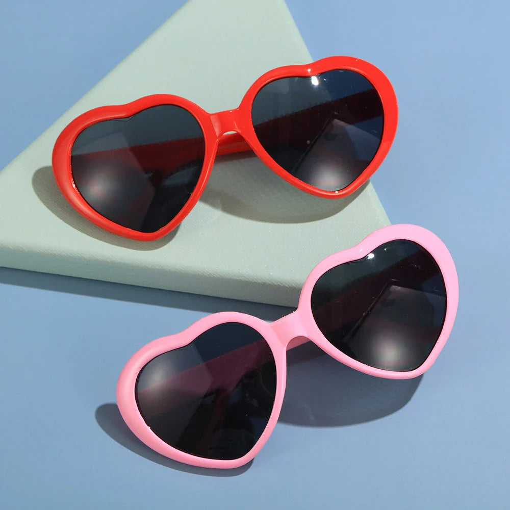 Fashionable heart-shaped light-up glasses with a built-in LED lighting system, perfect for adding a touch of love and playfulness to any occasion.