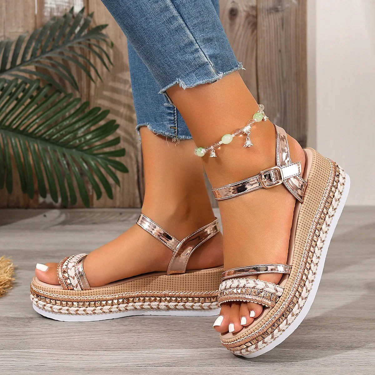 Women's gold wedge sandals with woven detail and round toe design