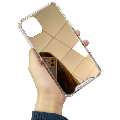 Silver mirrored phone case for Apple iPhone on a table, showing reflective back.