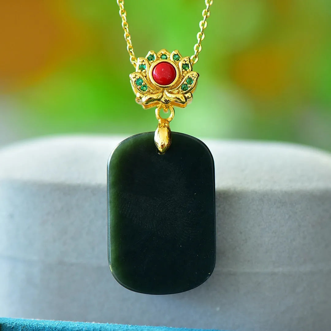 Copper inlaid pendant with natural grey Hetian jade and dark ink blue jade on a necklace.
