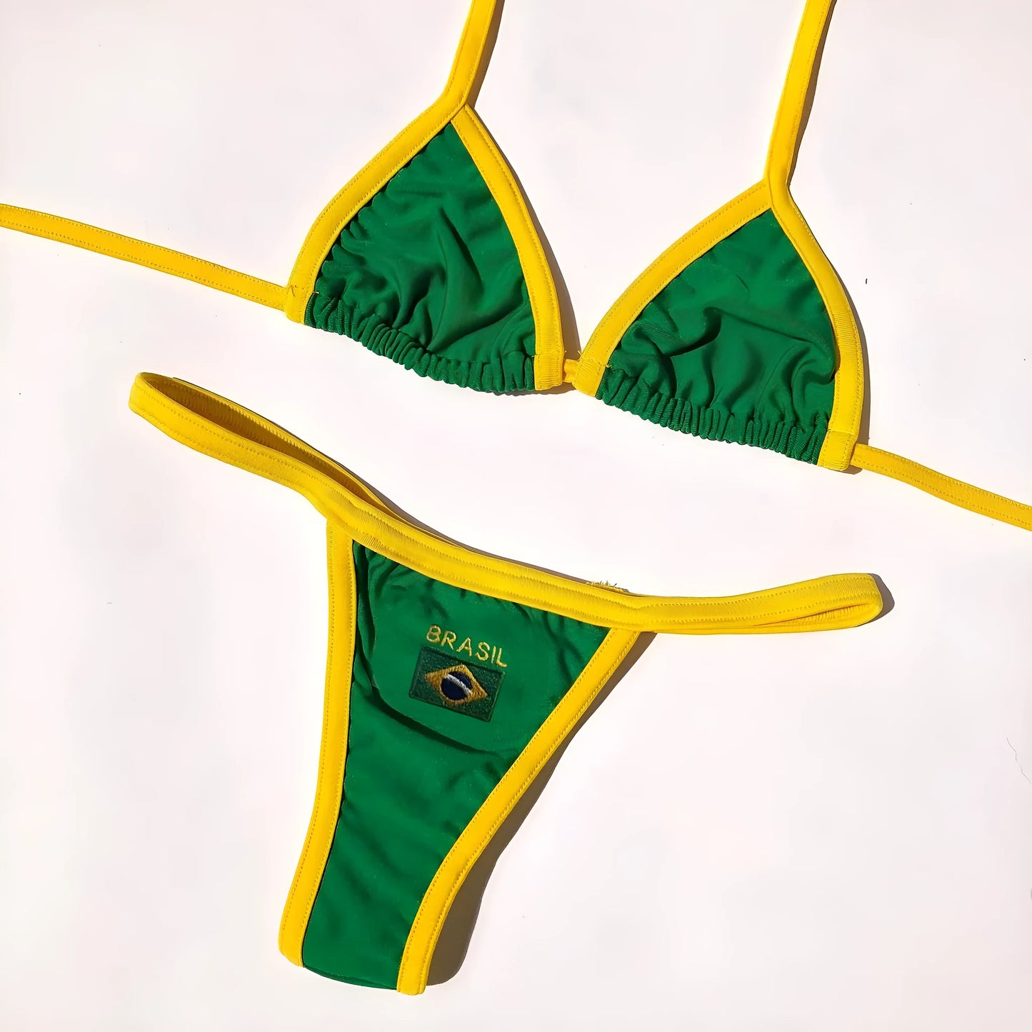 Women's yellow polyester bikini set with T-back bra and matching shorts on a mannequin