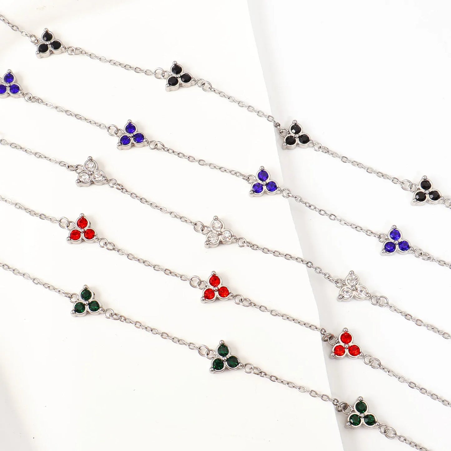 Women's stainless steel three diamond geometric triangular bracelet in gold finish with white zircon gemstones