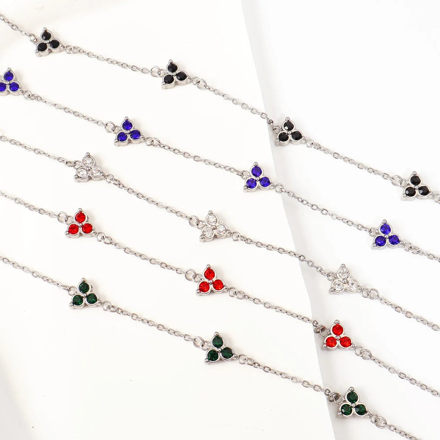 Women's stainless steel three diamond geometric triangular bracelet in gold finish with white zircon gemstones