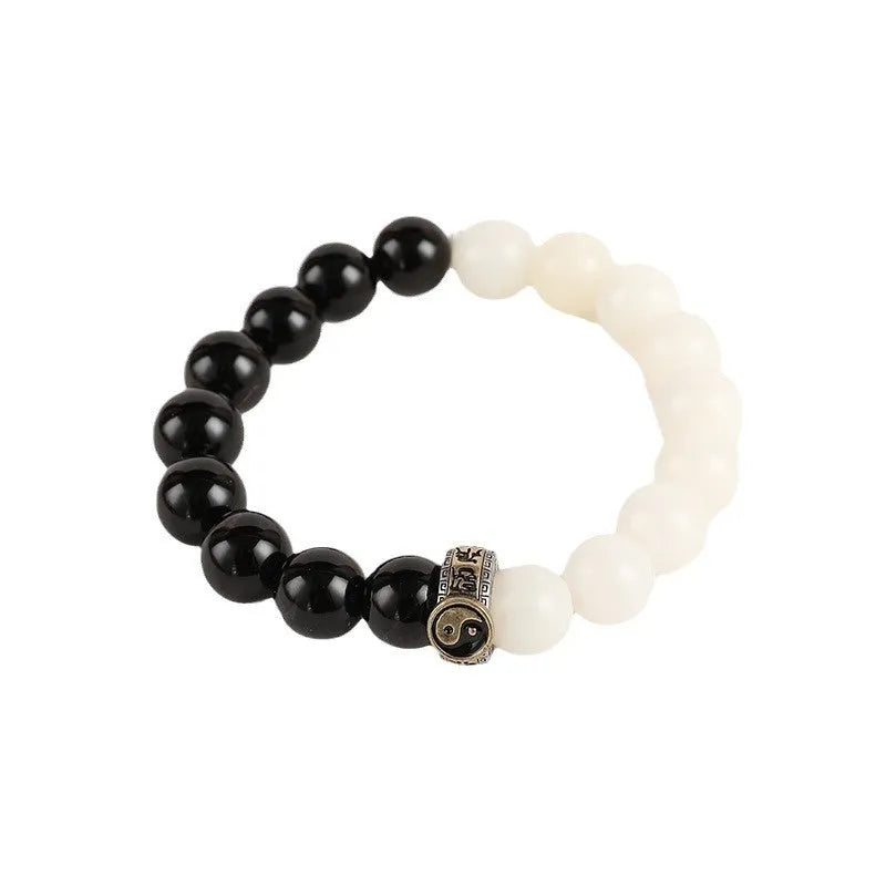 Black and white Tai Chi bracelet with obsidian beads and six-word mantra in geometric pattern